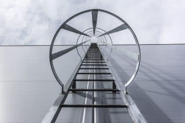 Iron,Ladder,On,The,Metal,Wall,Of,The,Warehouse